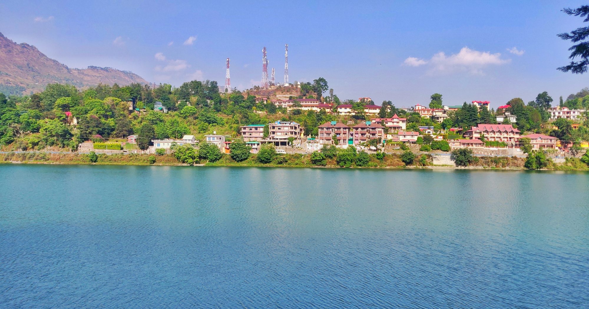 Wide afternoon view over Bhimtal lake and the surrounding hills