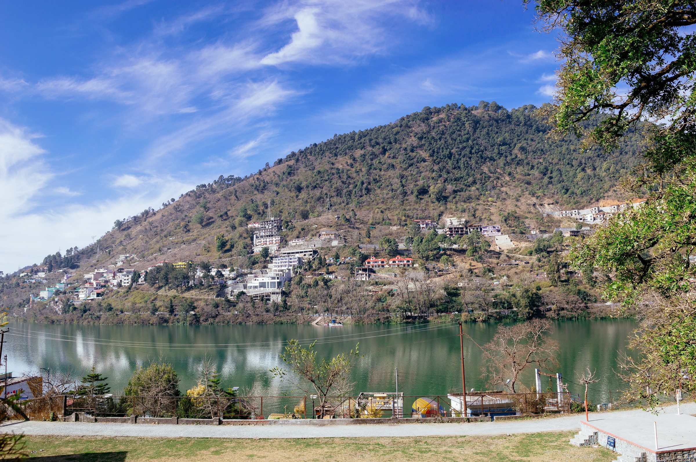 Forested Himalayan ridges rising above Bhimtal lake near Nainital